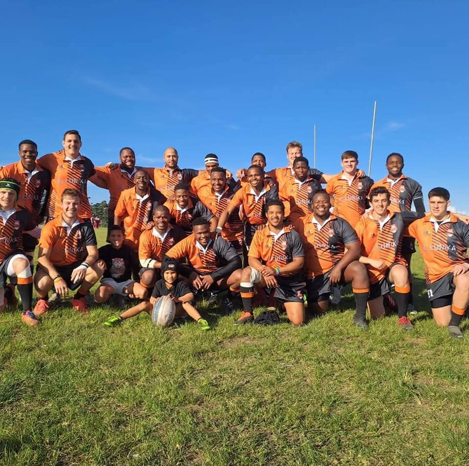 Olutsha Wolves squad photograph on the field after a match